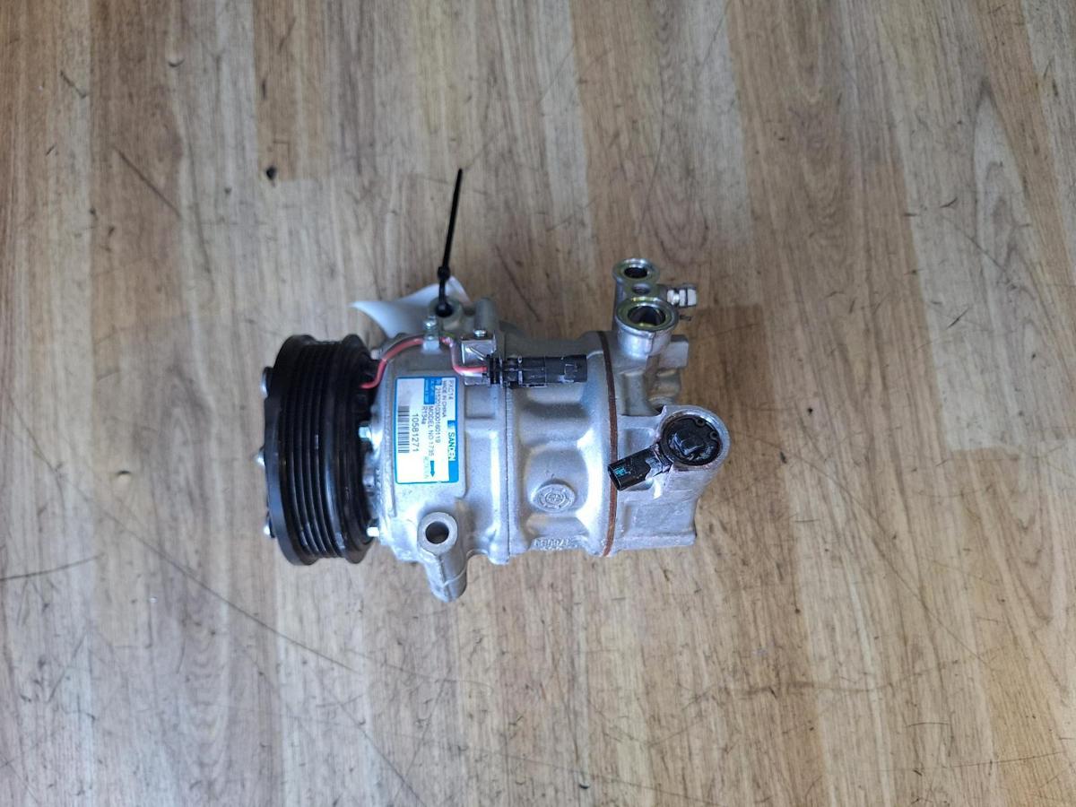 1000888310-A/C Compressor Top