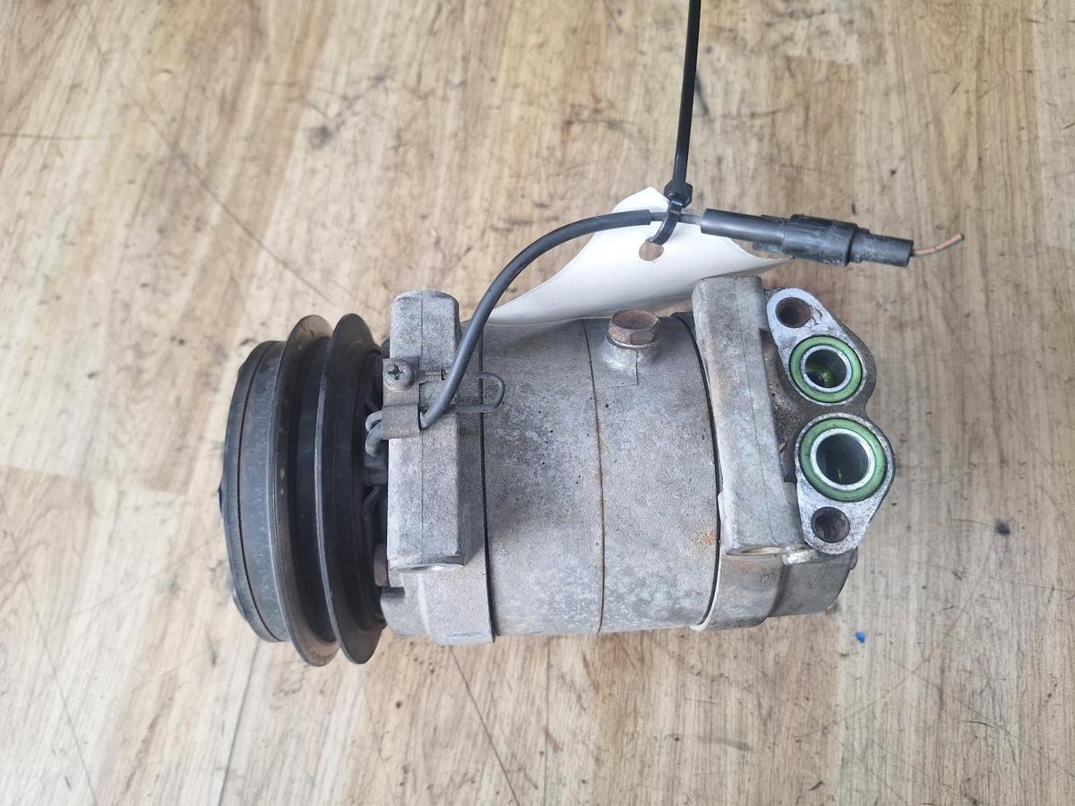 1000894197-A/C Compressor Top