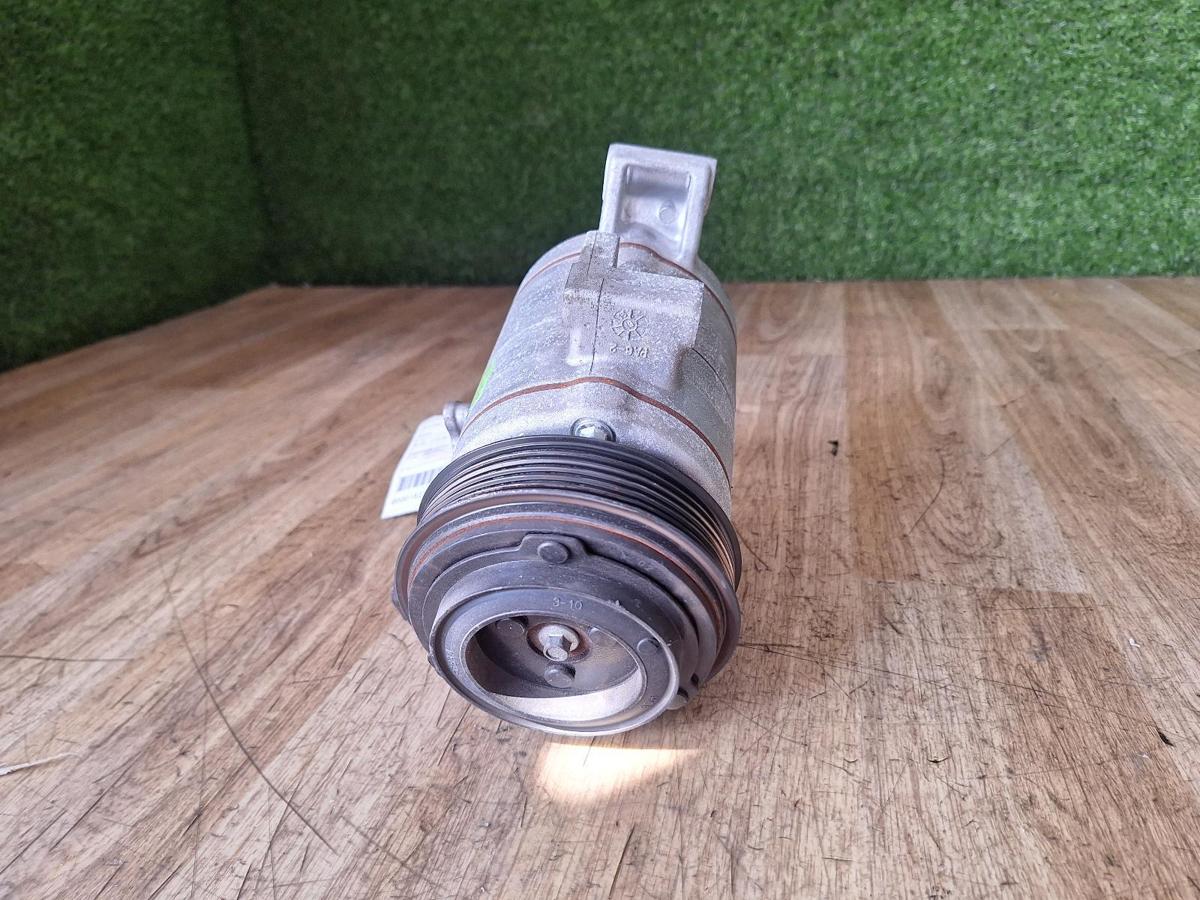 1000906329-A/C Compressor Top