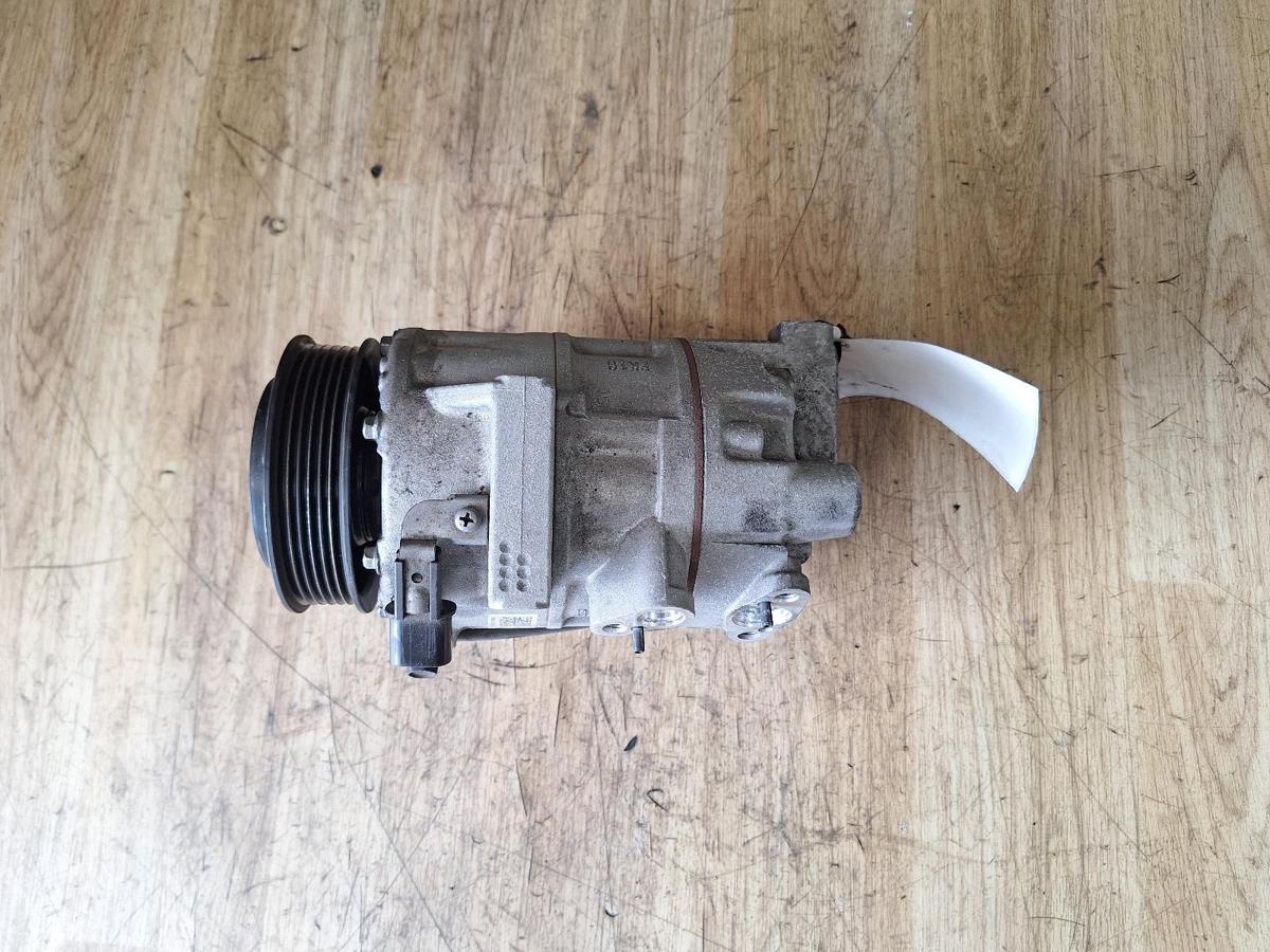 1000910019-A/C Compressor Top