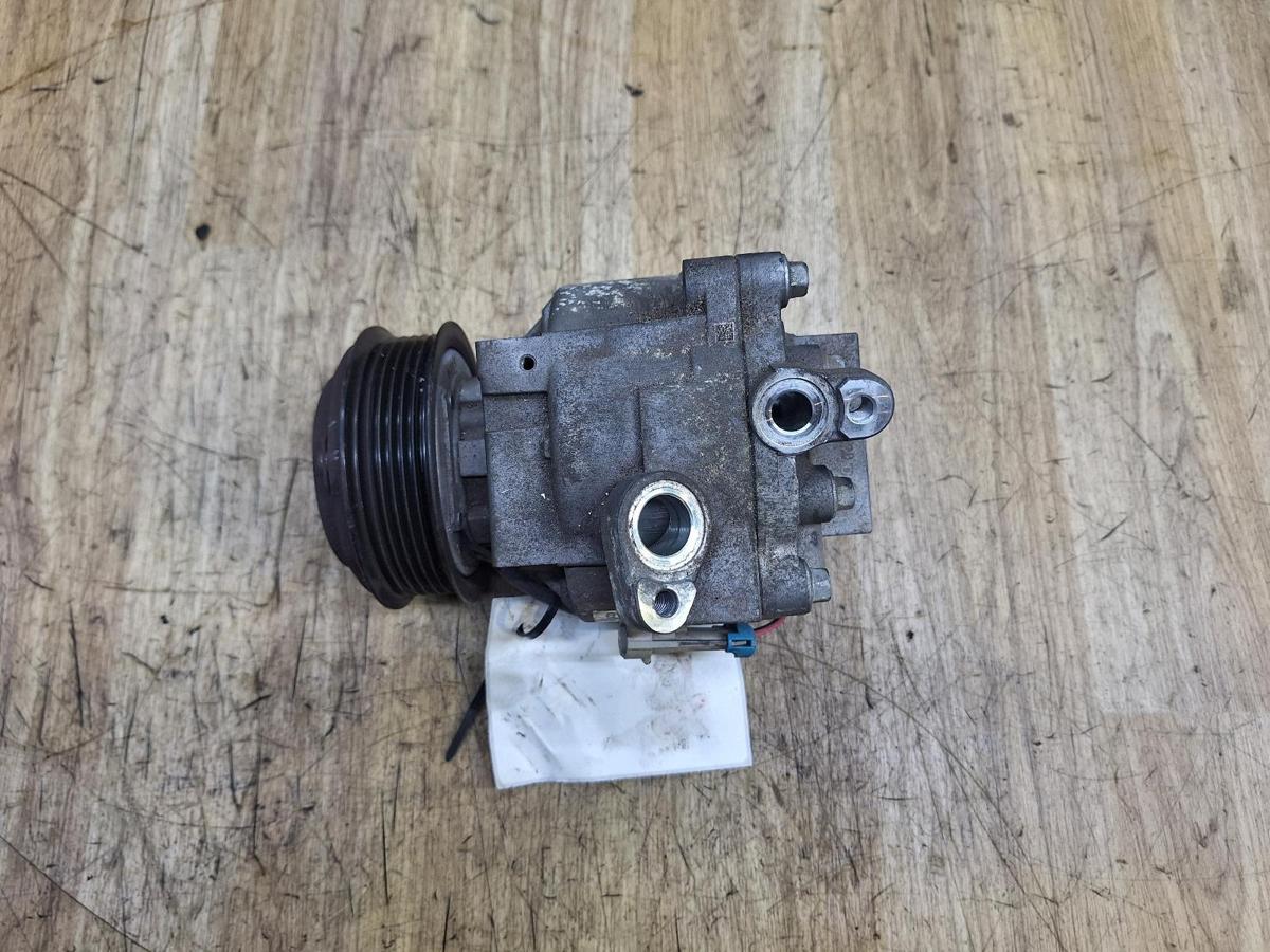 1000937591-A/C Compressor Top