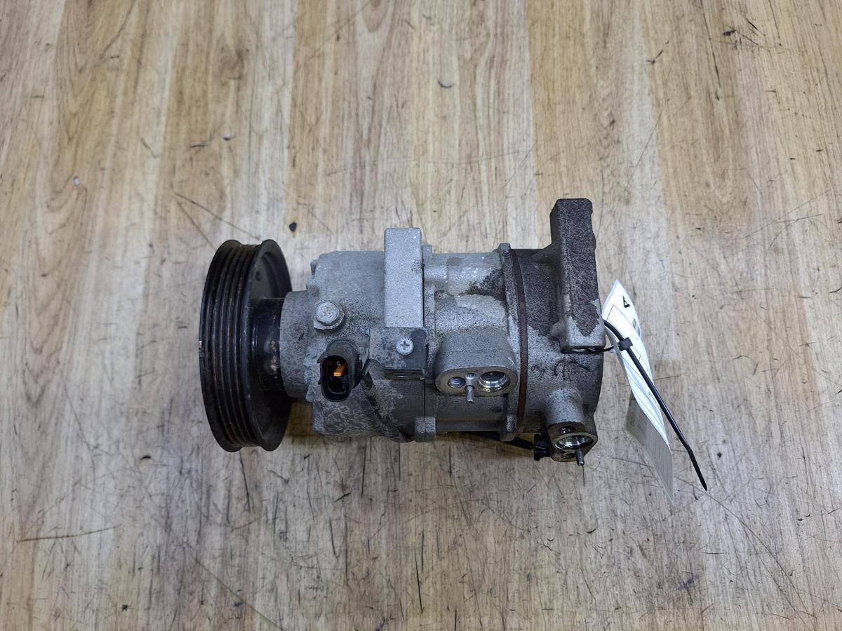 1000938627-A/C Compressor Top