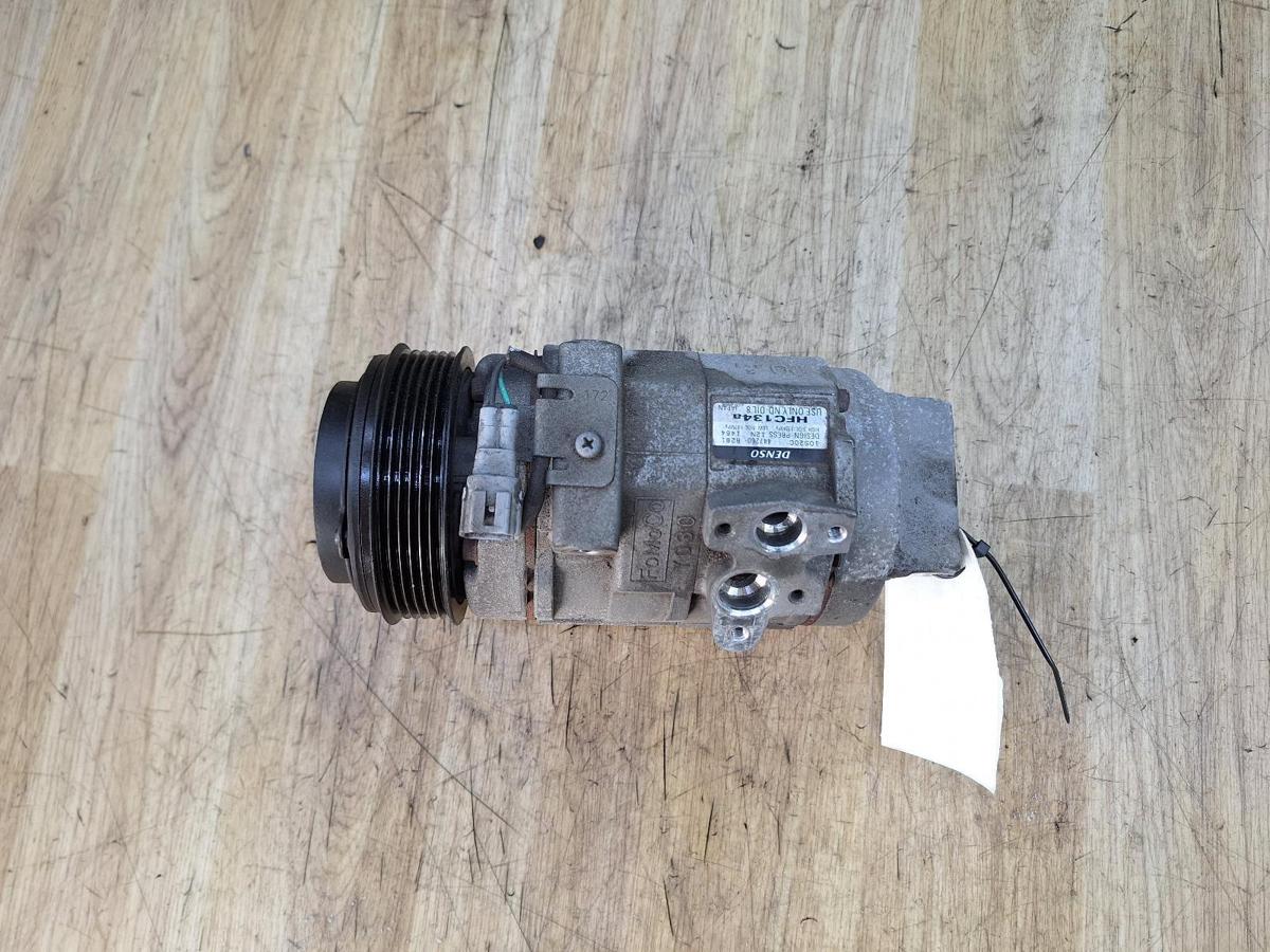 1000937389-A/C Compressor Top