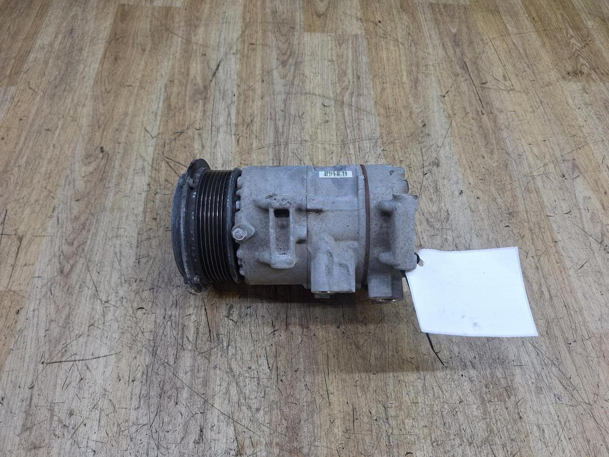 1000945625-A/C Compressor Top