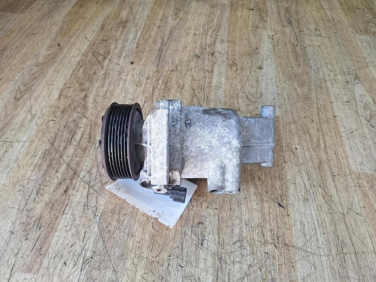 1000947579-A/C Compressor Top
