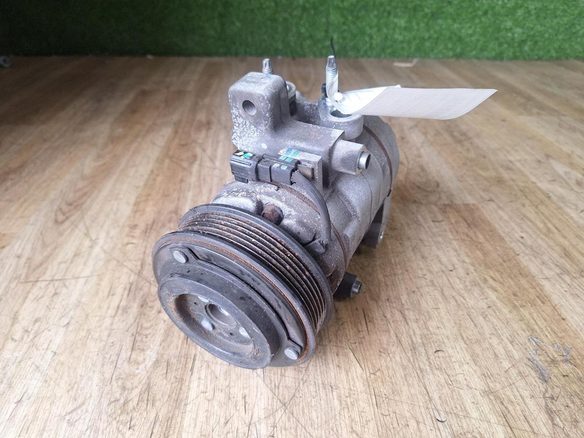 1000911131-A/C Compressor Top