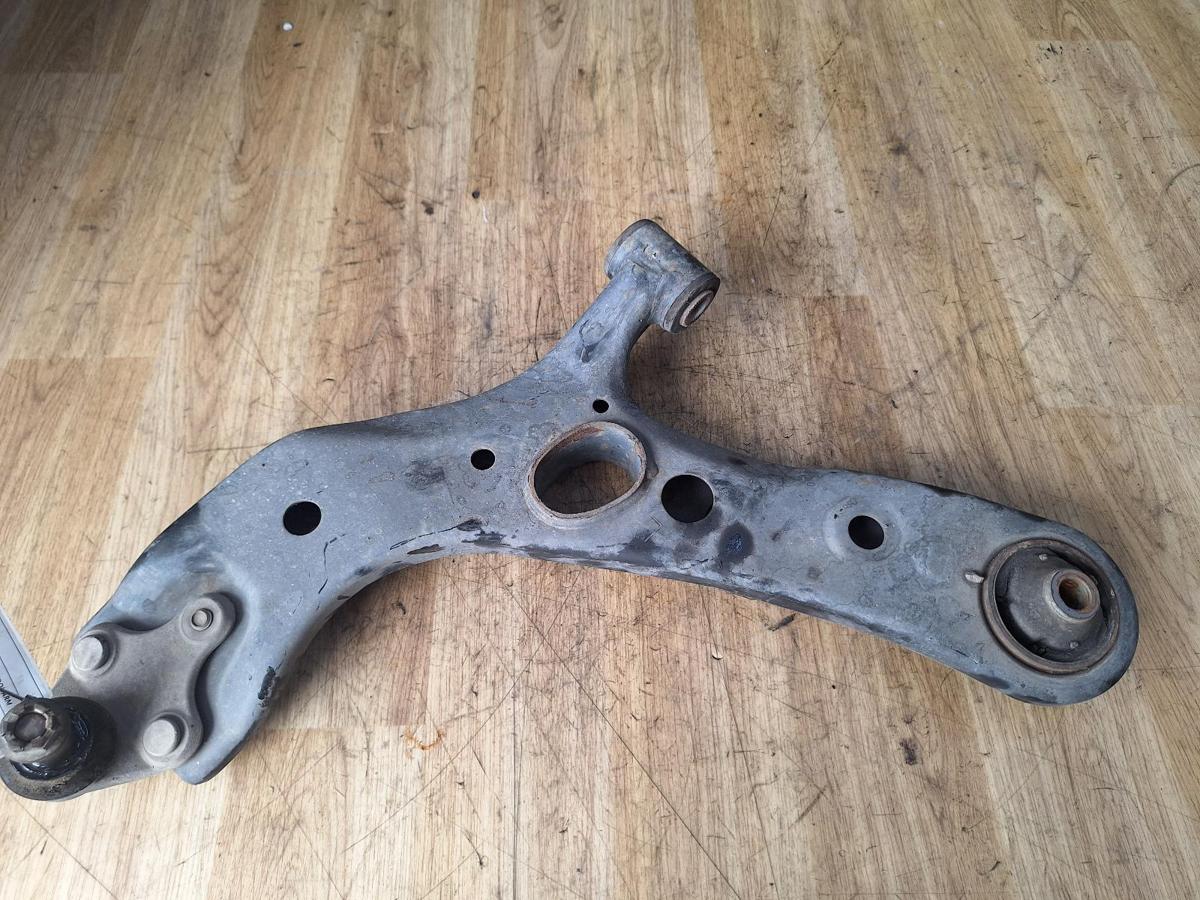1000892678-Left Front Lower Control Arm Top