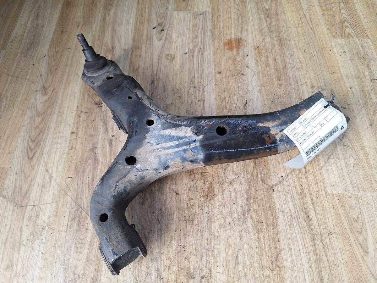 1000891499-Left Front Lower Control Arm Top