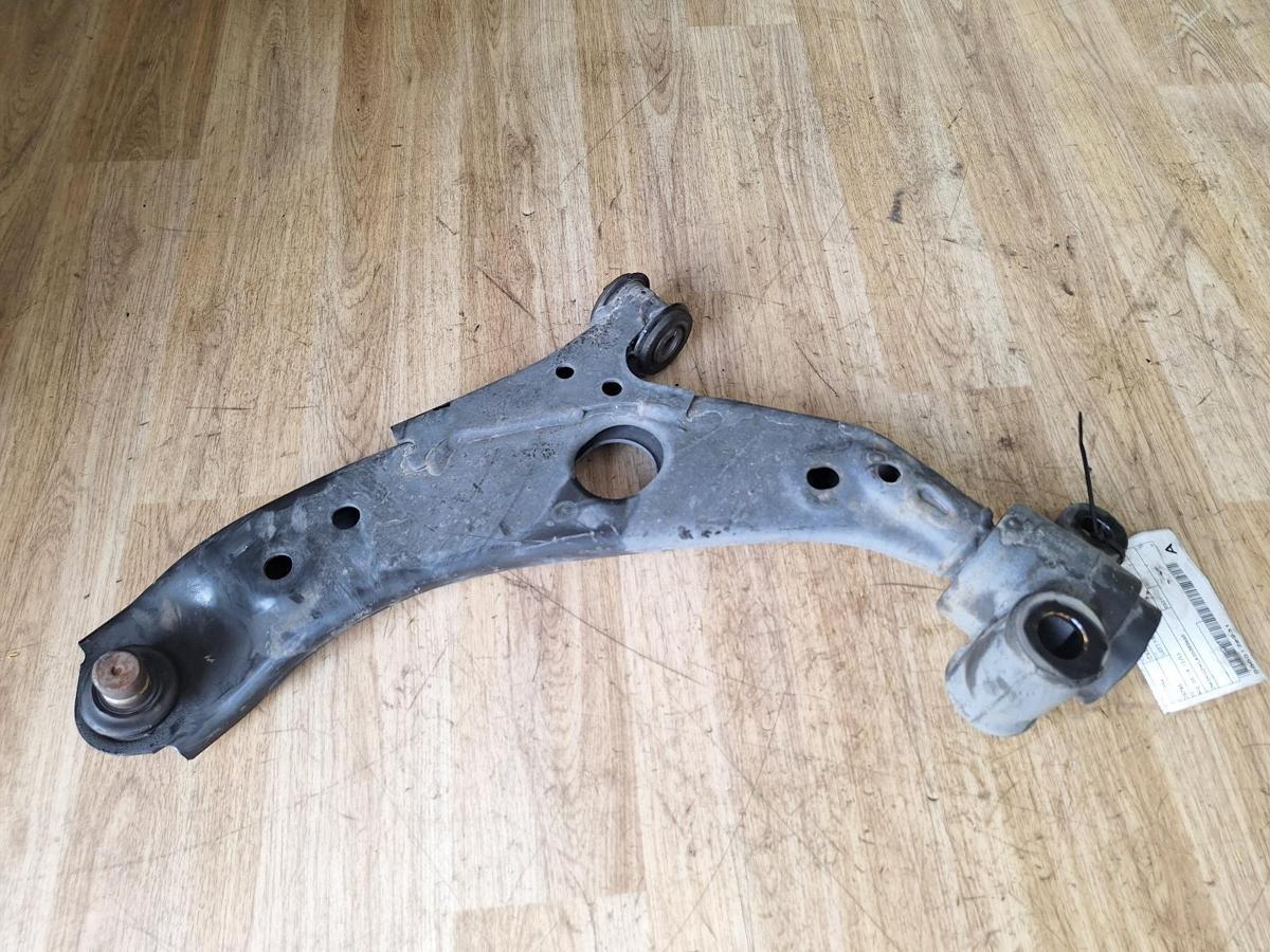 1000889097-Left Front Lower Control Arm Top