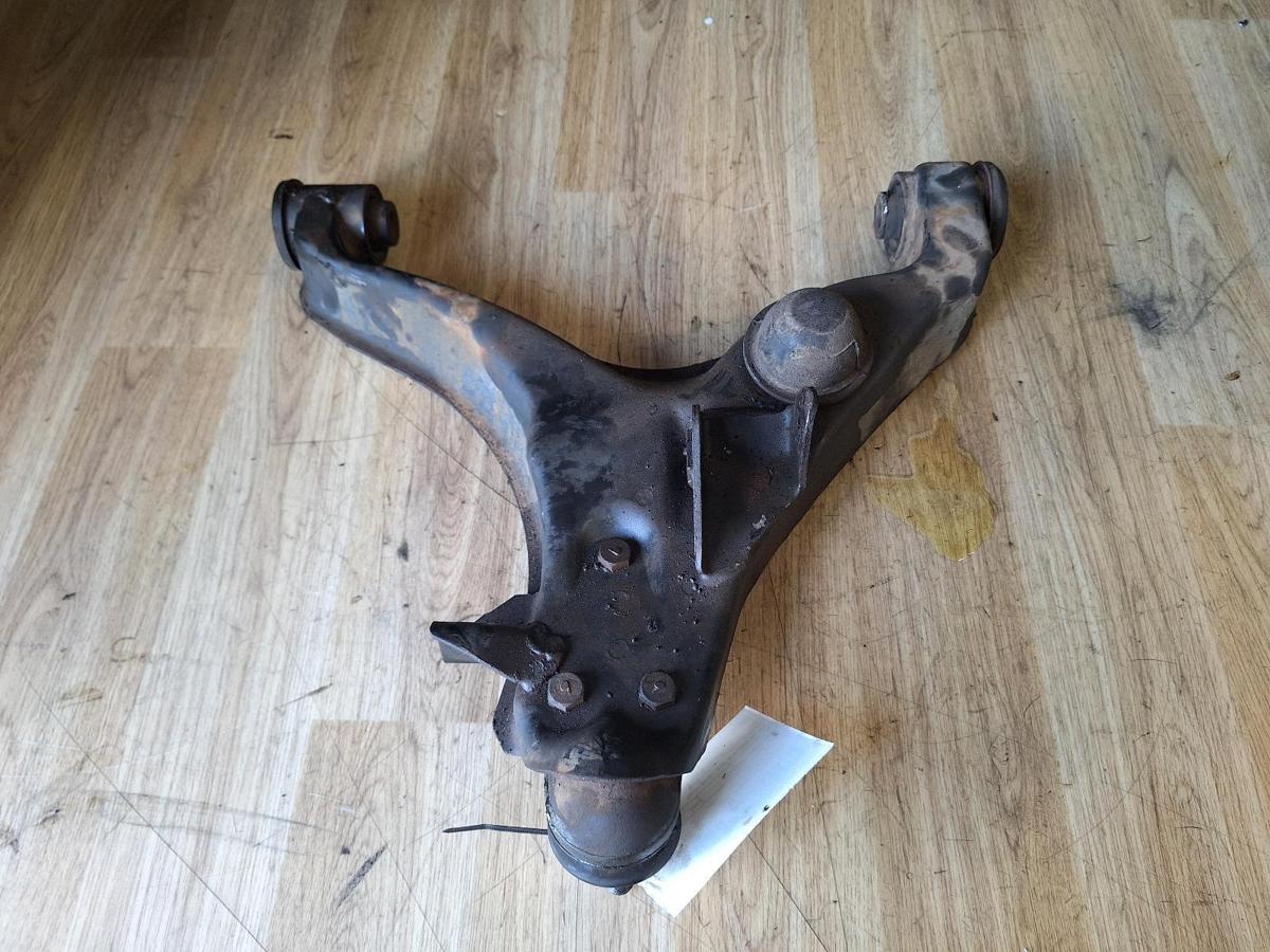 1000878026-Left Front Lower Control Arm Top