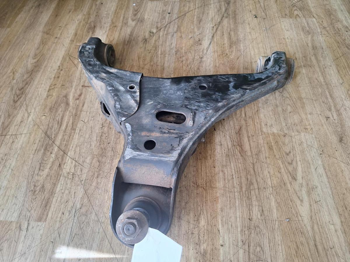 1000901675-Left Front Lower Control Arm Top