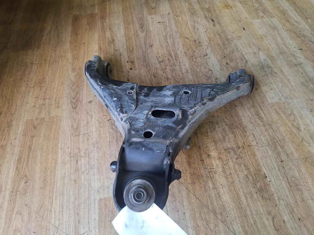 1000902669-Left Front Lower Control Arm Top