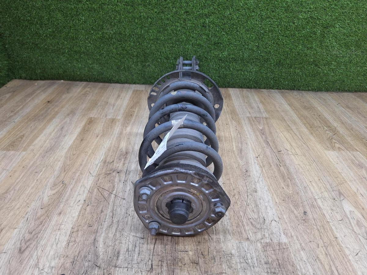 1000934121-Left Front Strut Top