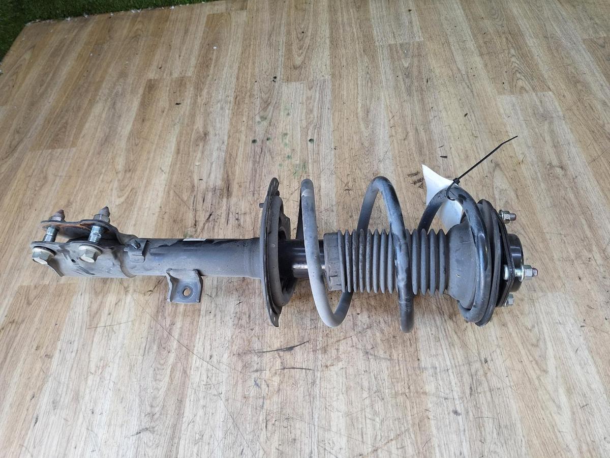 1000879671-Left Front Strut Top