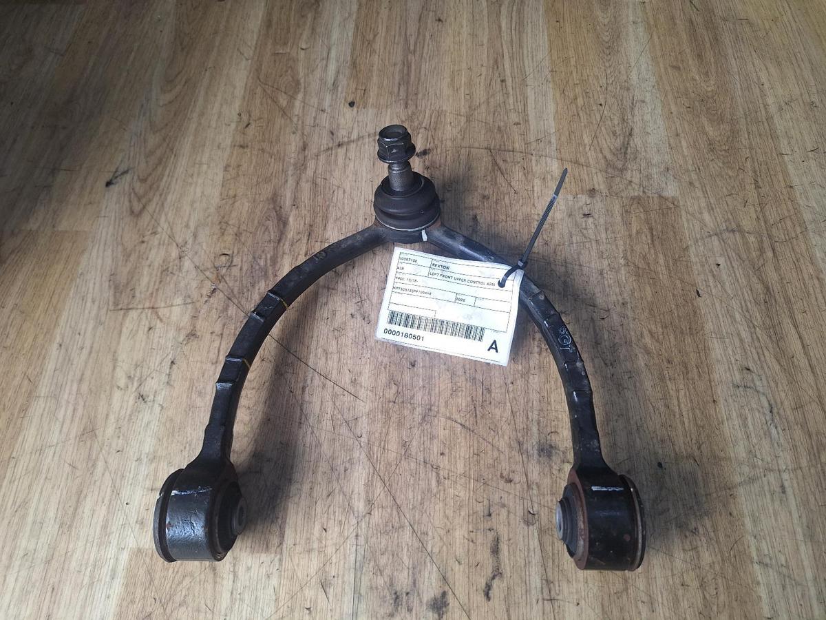 1000894976-Left Front Upper Control Arm Top