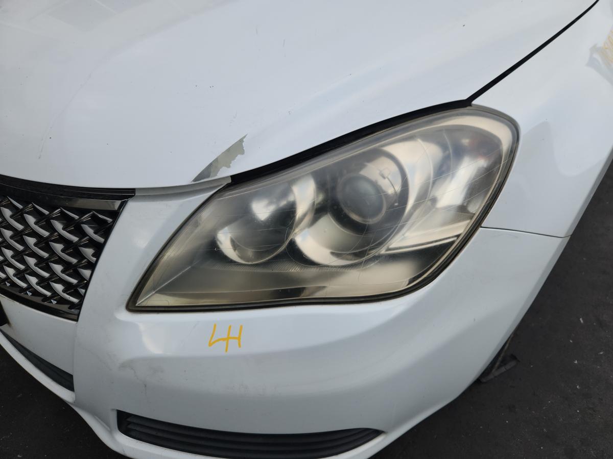 1000947877-Left Headlamp