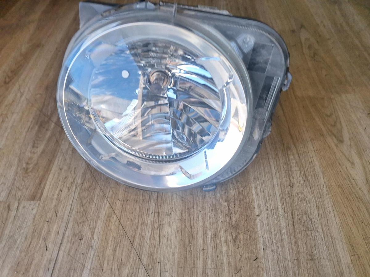 1000897577-Left Headlamp Top