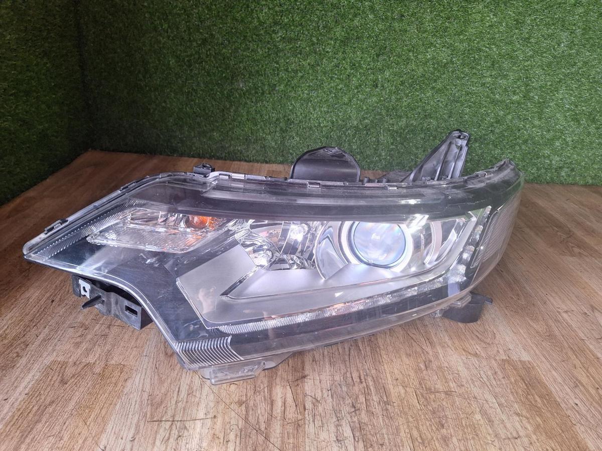 1000909218-Left Headlamp Top