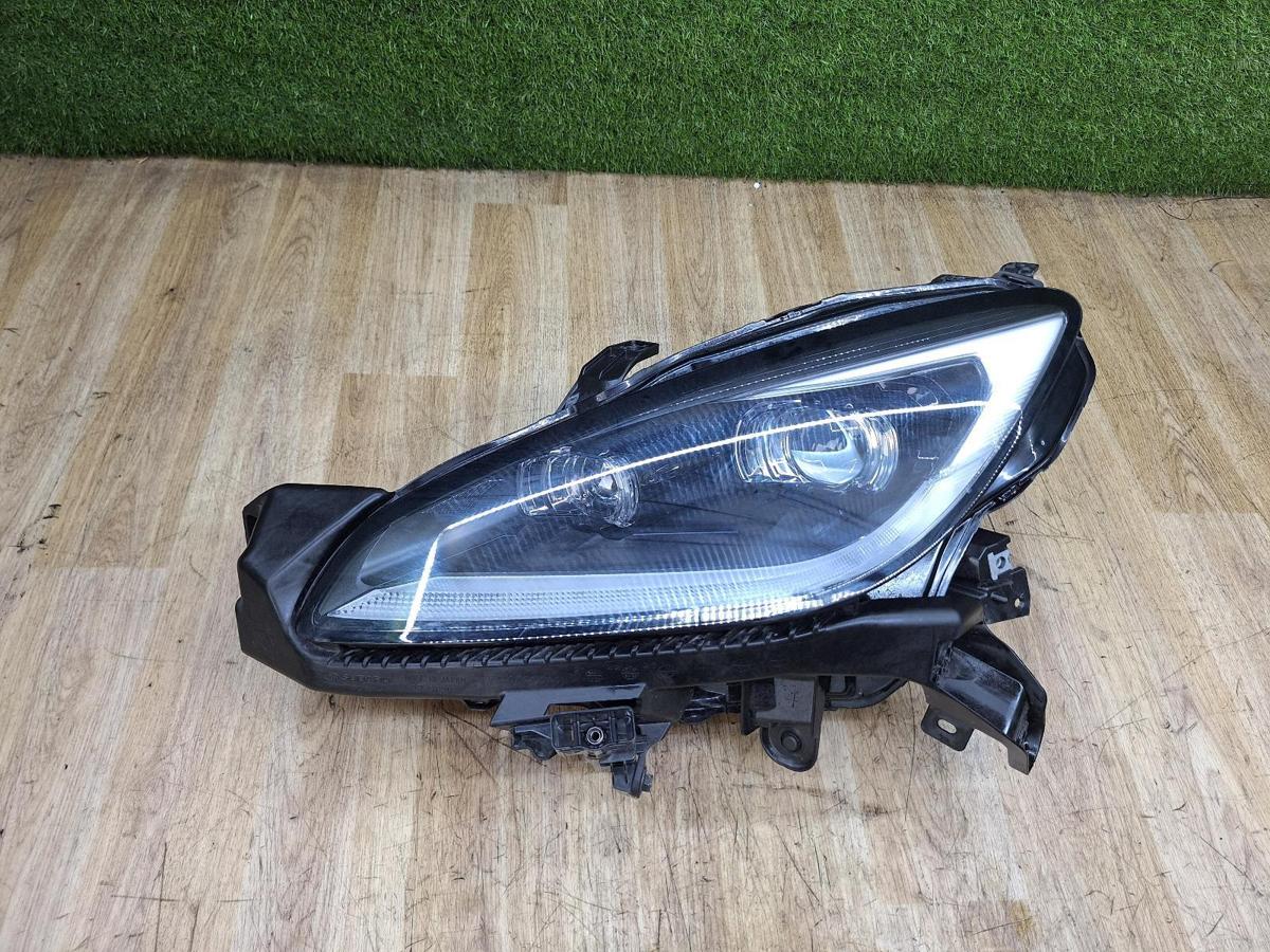 1000938385-Left Headlamp Top