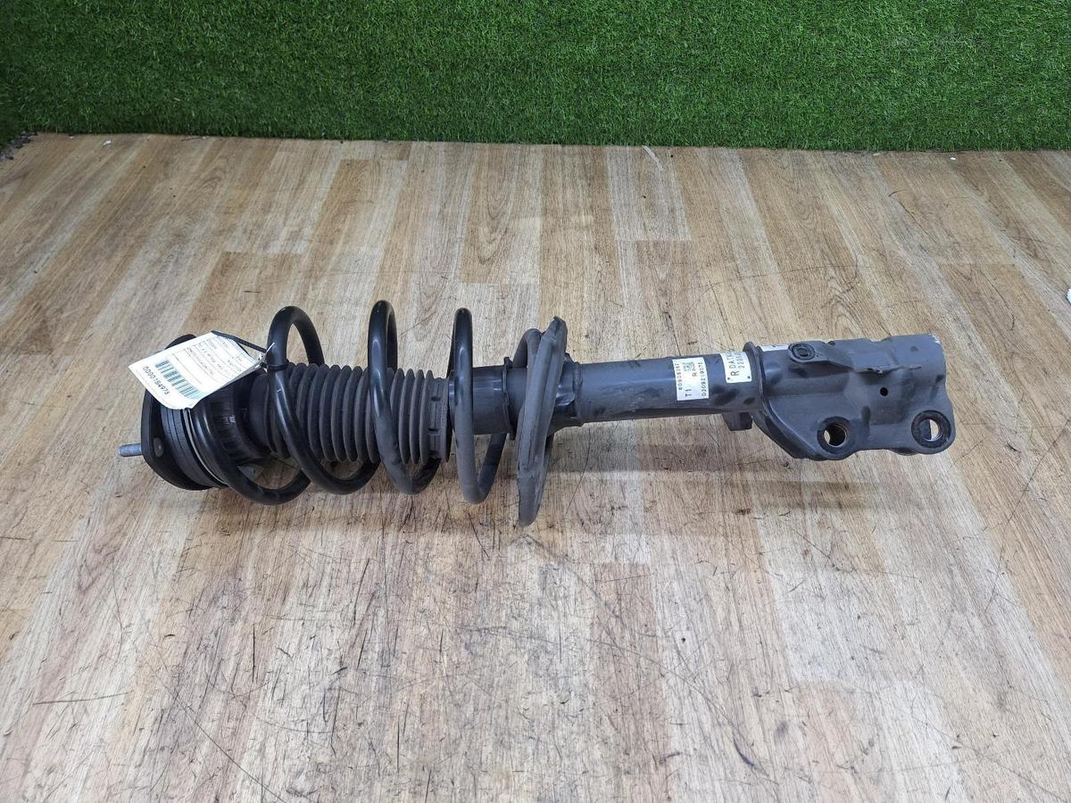 1000913409-Right Front Strut Top